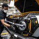 An engineer assembles the grille of a Ford Bronco